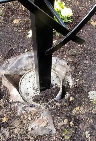 Close-up of the installation of the Charleston Rose Obelisk by Classic Garden Elements