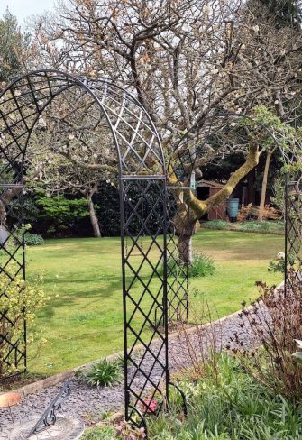 The Bagatelle Round-Top Garden Arch by Classic Garden Elements in private garden