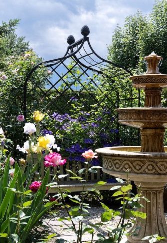 The Victorian Rose Arbour by Classic Garden Elements with bench and fountain in a private garden in Austria