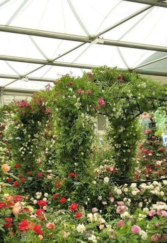 The Buscot Park Wedding Gazebo by Classic Garden Elements at the Chelsea Flower Show in 2018, alongside Malmaison Pyramid Garden Obelisks and Portofino Garden Arches