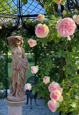 Close-up of statue in the middle of the Schoenbrunn Wrought-Iron Gazebo by Classic Garden Elements