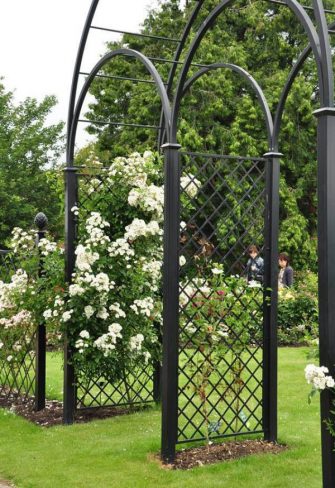 The Speke Hall Wedding Metal Arch – Triple Arch with Railing Panels, viewed from the side