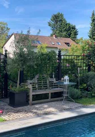 Bauhaus Metal Railing Panels by Classic Garden Elements enclosing pool area