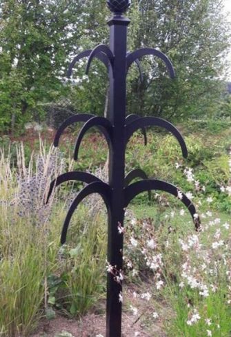 The Hannibal Garden Obelisk by Classic Garden Elements in a cottage garden