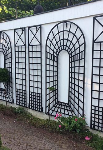 The Croome Espalier Trellis by Classic Garden Elements, with Trompe-l’œil Perspective Trellis Panels, installed on a white wall