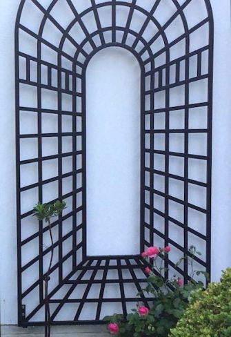 Classic Garden Elements' Trompe-l’œil Perspective Trellis Panels, Centre, installed on a white wall