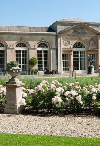 Several Classic Garden Elements Charleston Rose Obelisks in front of the Woburn Abbey Orangery