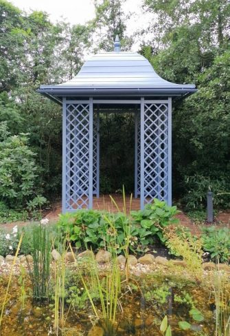 Classic Garden Elements' Wallingford Gazebo installed as the focal point near a pond