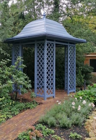 Classic Garden Elements' Wallingford Gazebo with full roof installed in a shady part of a garden