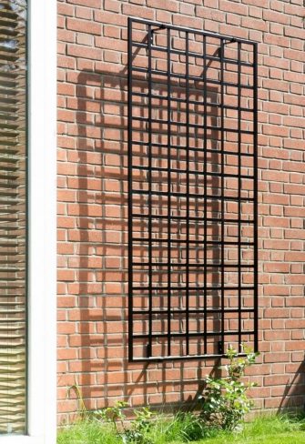 Large Modern Wall Trellis by Classic Garden Elements mounted on a brick wall