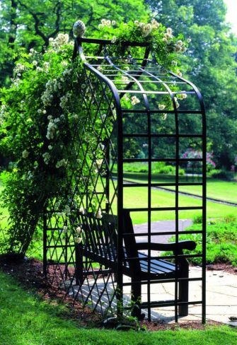 Side view of the Victorian Rose Arbour by Classic Garden Elements with a garden bench and rambler roses, at Westfalenpark, Dortmund