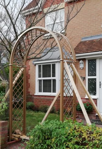 The Portofino Romanesque Garden Arch in the front garden of a London home