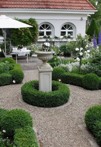 The Jules Gravereaux Garden Stakes providing support to 'Snow White' standard roses in the gardens designed by Götz Lauenstein in Würzburg