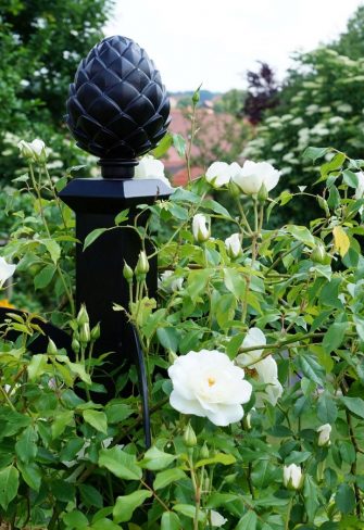 Close-up of a Classic Garden Elements Hannibal Garden Obelisk with pine-cone finial