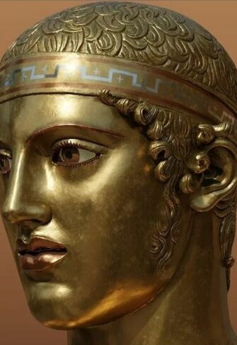 Head of Charioteer of Delphi with the original high-gloss golden sheen sur...bronze